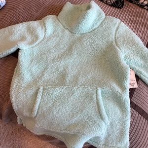 Light blue extremely cozy sweater! Never worn and tags on.